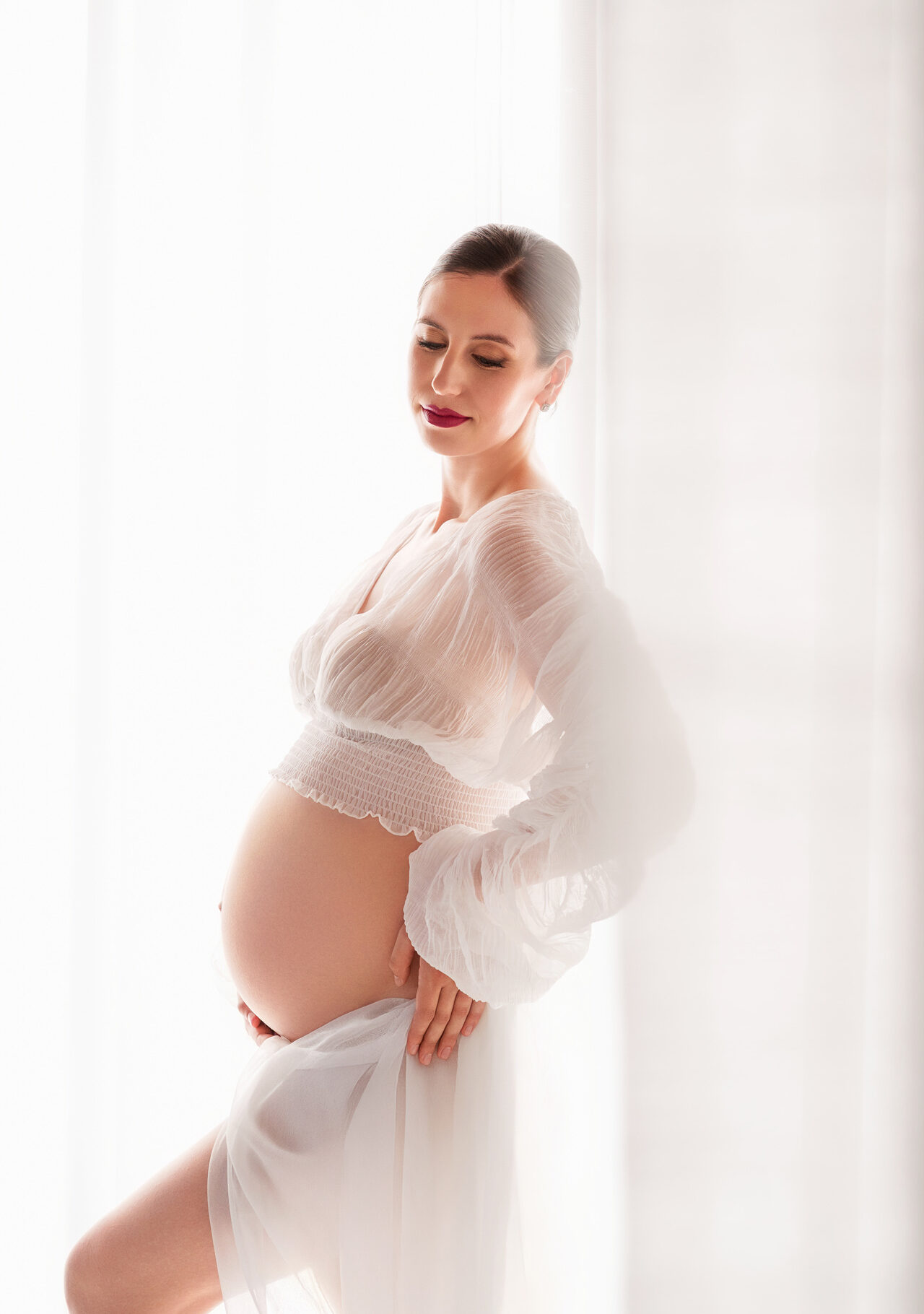 elegant maternity portrait in Skåne with soft natural light