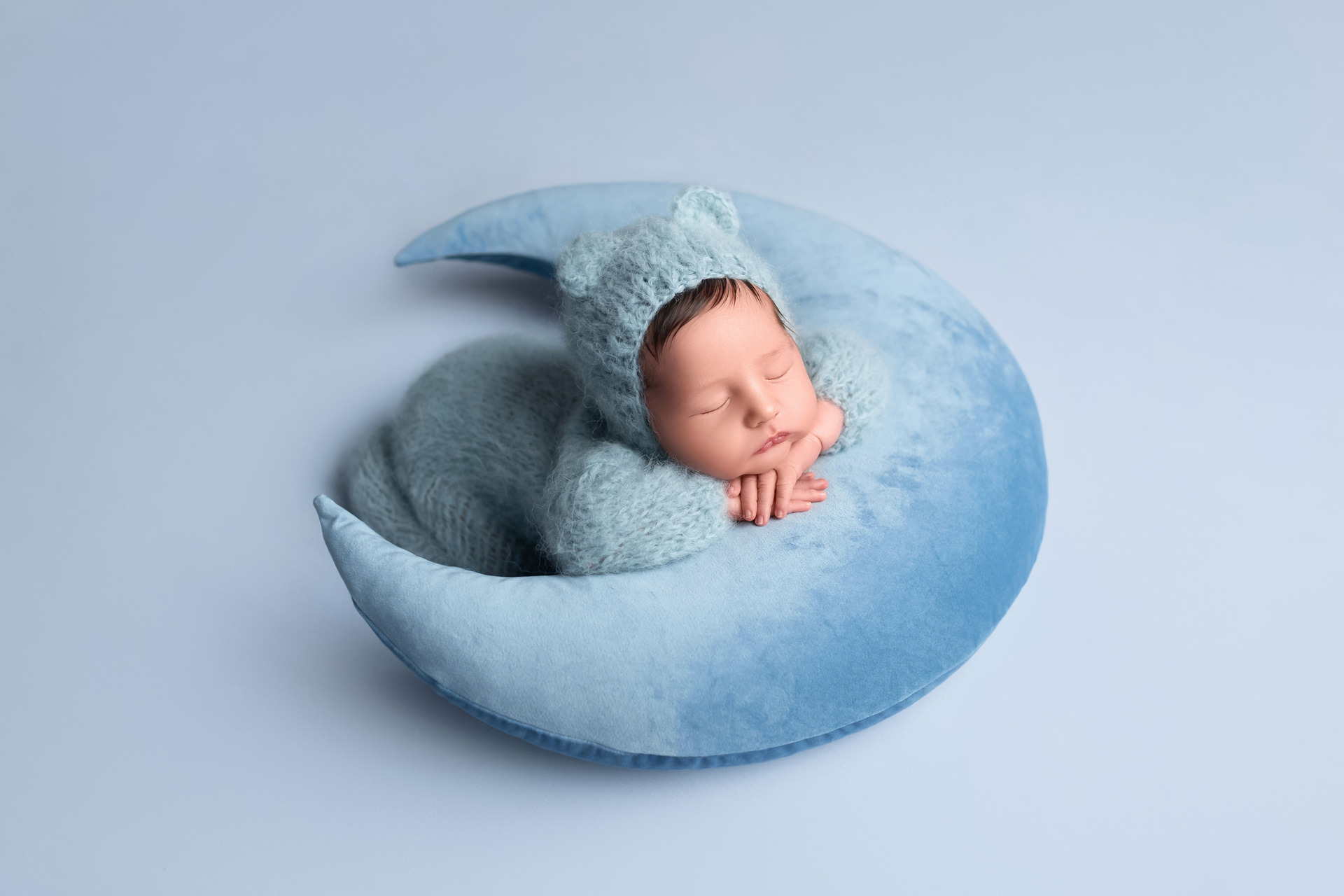 Beautiful-newborn-baby-wrapped-in-a-handmade-knit-outfit