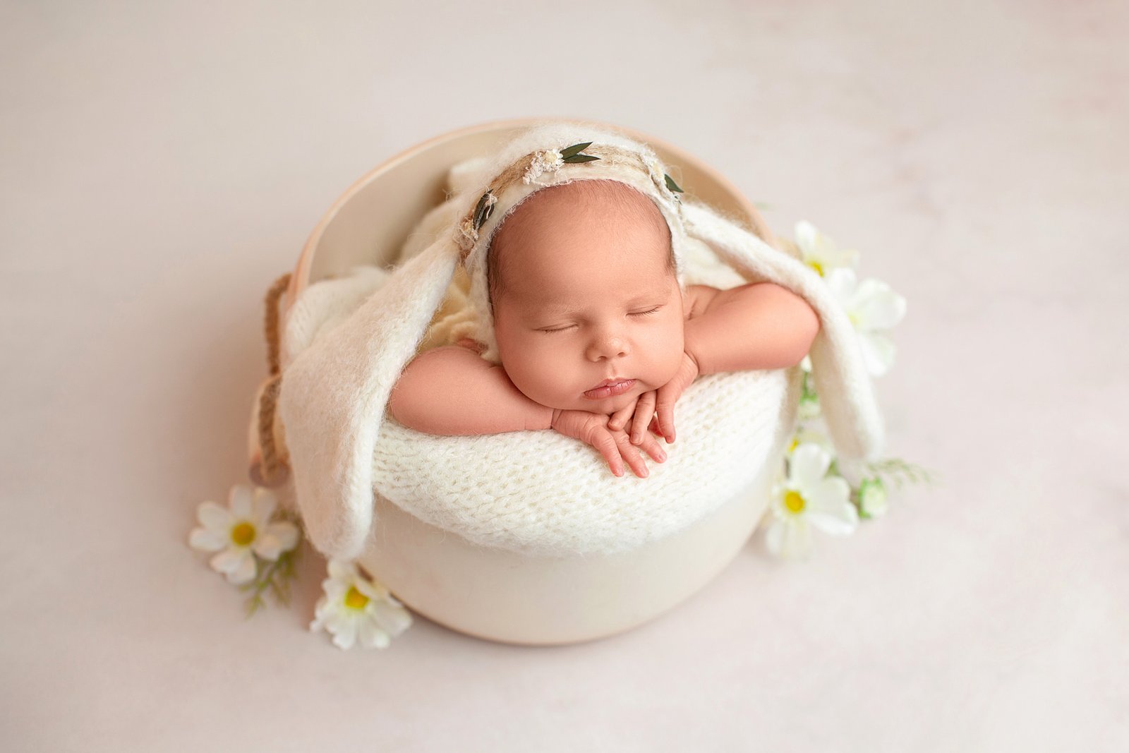 Sleeping-newborn-baby-in-a-handcrafted-wooden-bowl